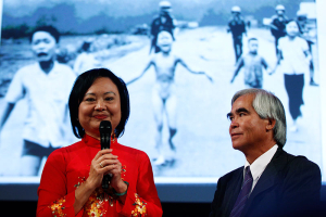 Photojournalist Nick Ut and Kim Phuc (L) attend the presentation of the latest Leica equipment at Photokina 2012, the world's largest fair for imaging, in Cologne September 17, 2012. Ut took the iconic 1972 Vietnam War photograph of Kim Phuc running naked down a road after being burned in a napalm attack near Trang Bang. More than 1,200 exhibitors from 45 countries will show their latest products at the Photokina 2012 from September 18-23. REUTERS/Ina Fassbender  <br/>