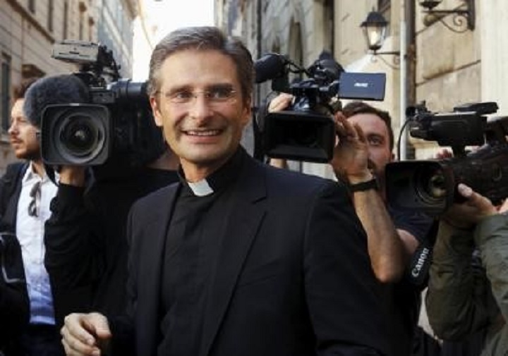 The Vatican on Saturday dismissed a Polish priest from his Holy See job after he came out as gay and called for changes in Catholic teachings against homosexual activity on the eve of a major Church meeting on the family.