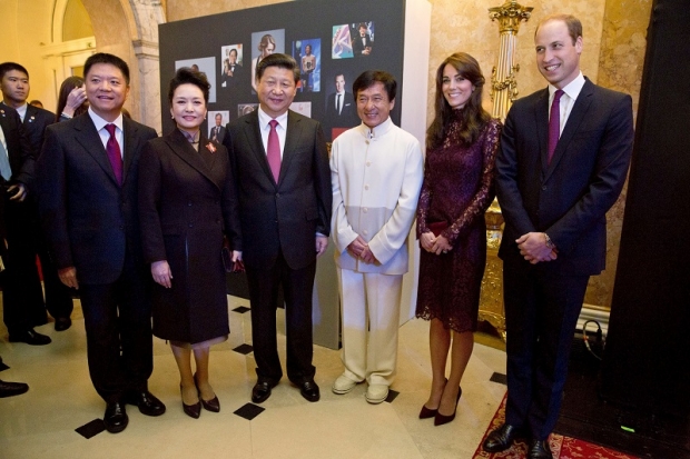With China's state visit to Buckingham Palace now considered a smashing success, readers worldwide were left intrigued at how Jackie Chan suddenly emerged in pictures with Chinese President Xi Jinying and First Lady Peng alongside the Duke and Duchess of Cambridge.
