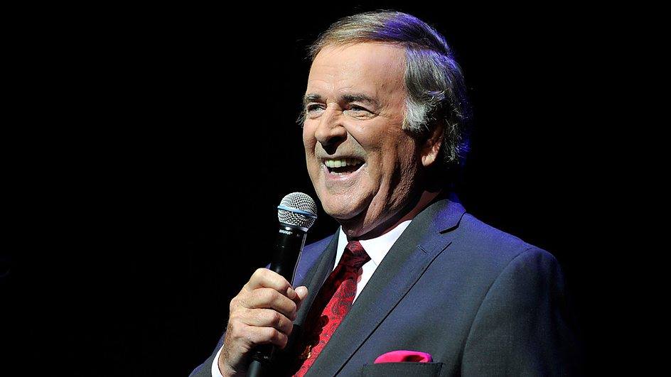 One of the last people to visit Sir Terry Wogan before he died Sunday, Jan. 31, was lifelong friend and Catholic priest, Father Brian D'Arcy, leading to speculation the self-confessed atheist may have turned back to God in his final weeks. Wogan died at the age of 77 after suffering from cancer.