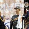 Denver Broncos' quarterback Peyton Manning holds the Vince Lombardi Trophy after the Broncos defeated the Carolina Panthers in the NFL's Super Bowl 50 football game in Santa Clara