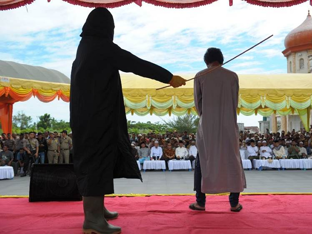 An elderly Christian woman was publicly whipped nearly 30 times in a conservative province in Indonesia for selling alcohol as the persecution of Christians continues to rise in the predominantly Muslim country.