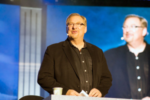 Rick Warren is the author of ''The Purpose Driven Life'' and pastor of Saddleback Church in California. Warren is shown speaking at the NRB Convention ''Proclaim 16''  held in Nashville, Tennessee. <br/> The Gospel Herald