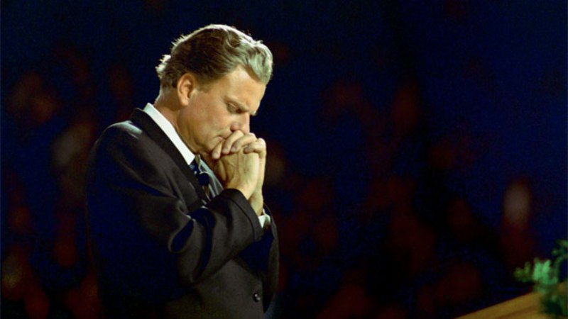 Rev. Billy Graham said while he doesn't believe prayer will return to public schools since it was barred five decades ago, he reminds there are other ways students can communicate with God throughout their school day. "When I was young, we used to pray and read the Bible in school every day, but my grandchildren aren't able to experience this, and it upsets me a great deal," stated the 97-year-old evangelist.
