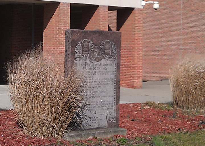 The Ten Commandments will be removed from a Pennsylvania high school after an atheist filed a lawsuit claiming monument was "offensive" to her and her daughter.