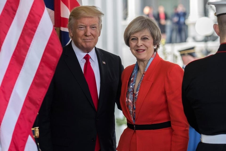Donald Trump will travel to the UK - despite reports the state visit had been cancelled - as the U.S. and Britain attempt to work together despite glaring differences.