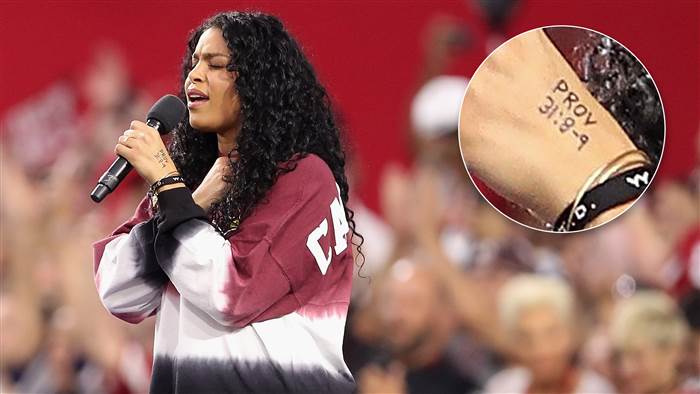 Jordin Sparks issued a subtle message while singing the National Anthem before the Dallas Cowboys took on the Arizona Cardinals in Glendale, Arizona, inscribing a Bible verse on her hands.