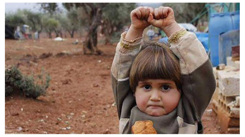 Heartbreaking Photo of Syrian Girl Raising Hands in Surrender