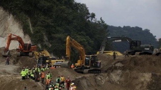 In Guatemala Mudslide, Searchers Find Entire Dead Families Huddled Together